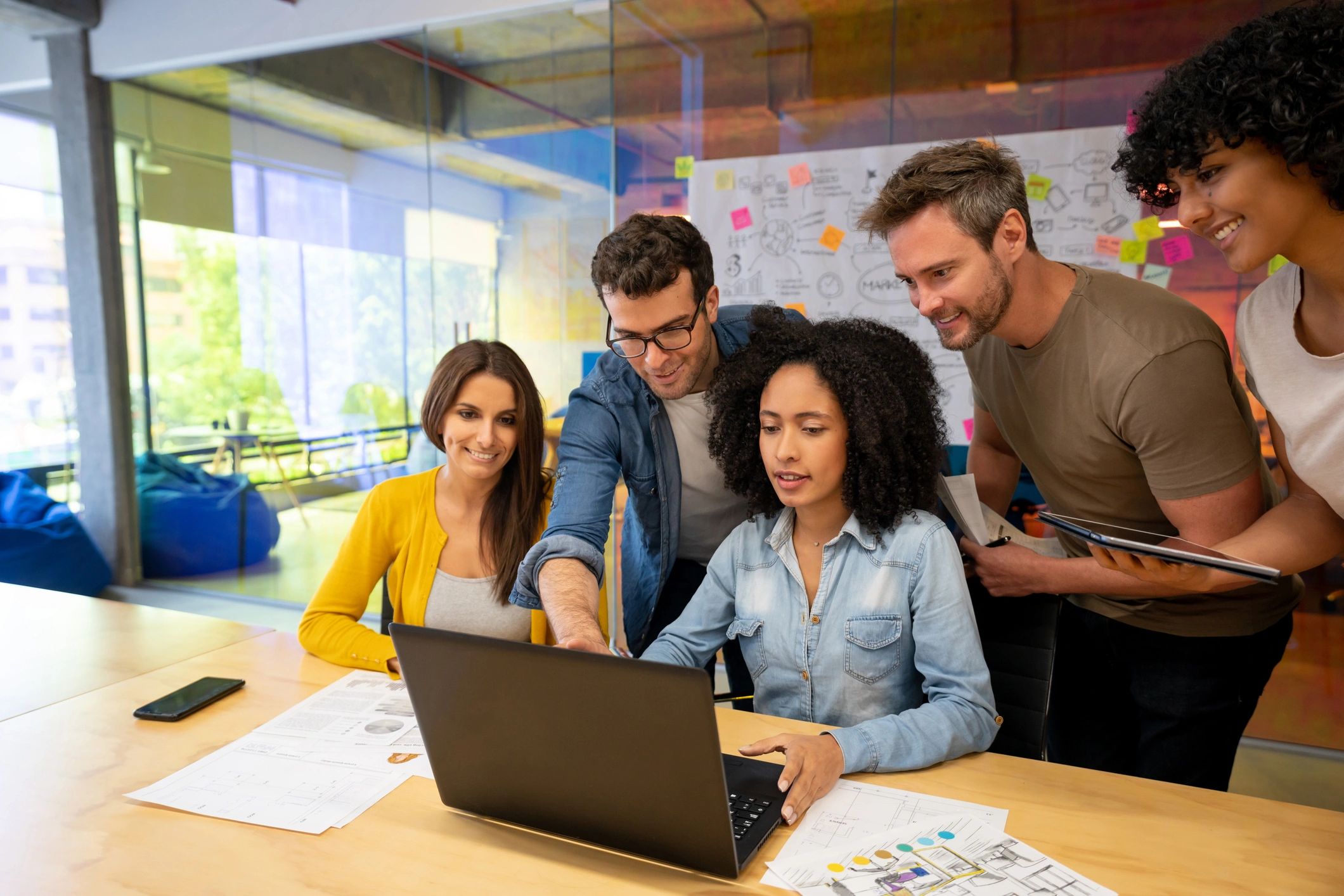 Digital marketing team collaborating in western-inspired office